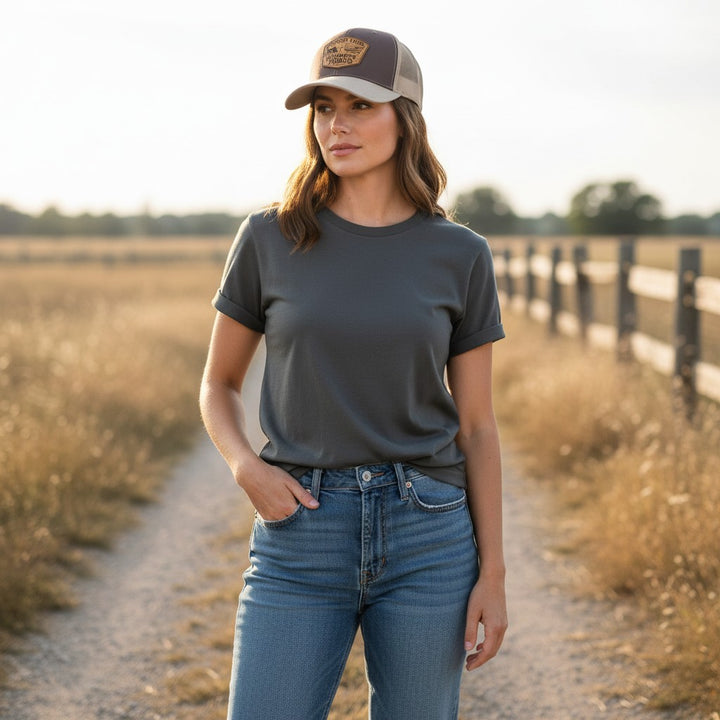 WeEngrave USA brown and tan Richardson 112 trucker hat with engraved leather patch featuring a tractor, American flag, and "Country Loud Midwest Proud" text.