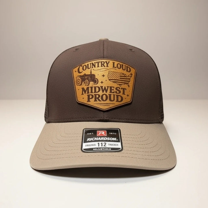 WeEngrave USA brown and tan Richardson 112 trucker hat with engraved leather patch featuring a tractor and American flag.
