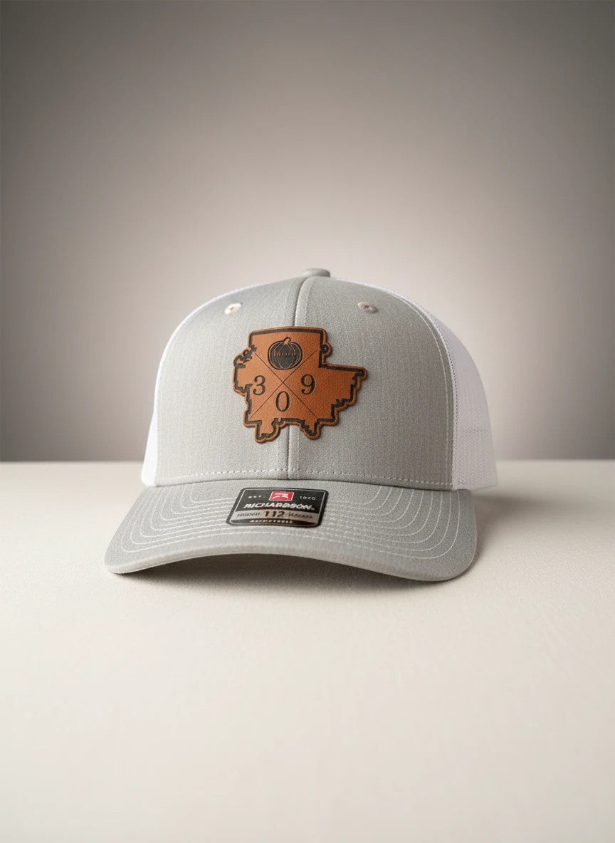 WeEngrave USA grey trucker hat with white mesh back and custom engraved leatherette patch featuring a map outline with 309.