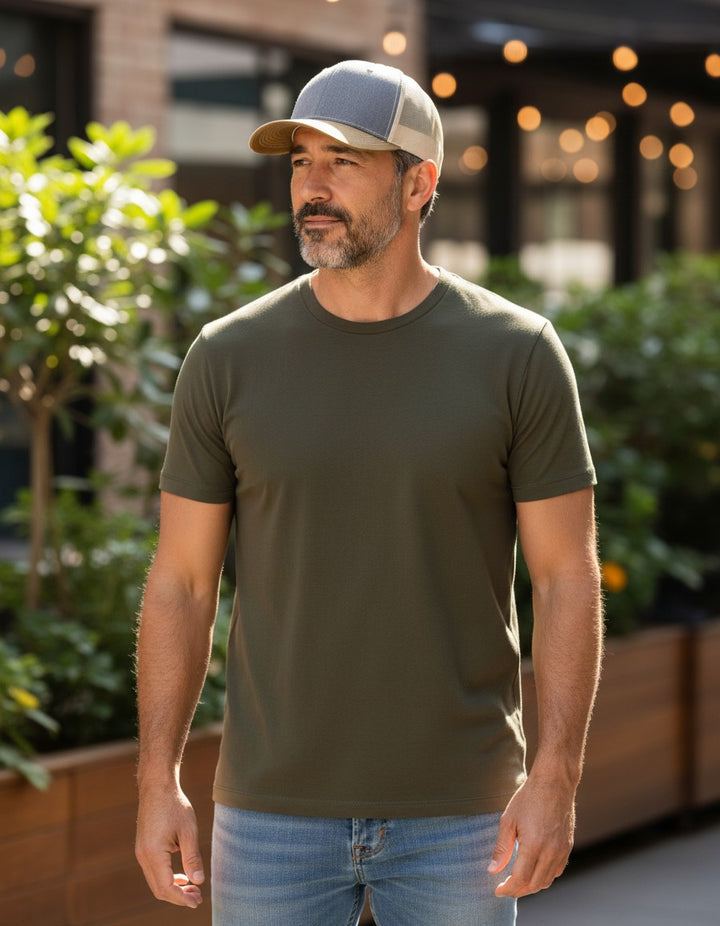WeEngrave USA trucker hat with heather grey front, beige mesh back, and amber gold visor. Features a mid-profile, precurved visor, and cotton sweatband.